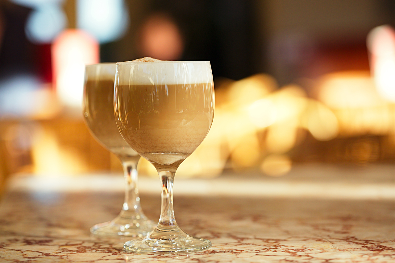 Spanish coffee latte in tall glasses with morning sunny background