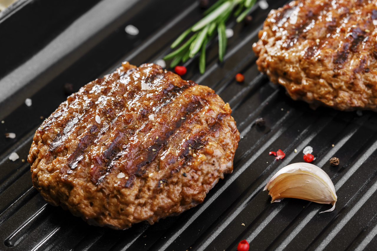 Beef burger on a barbecue