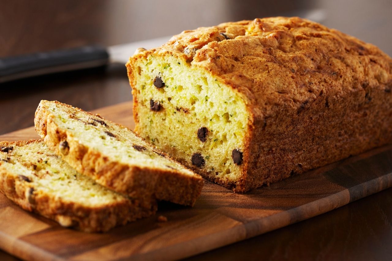 zucchini loaf sliced on a cutting board