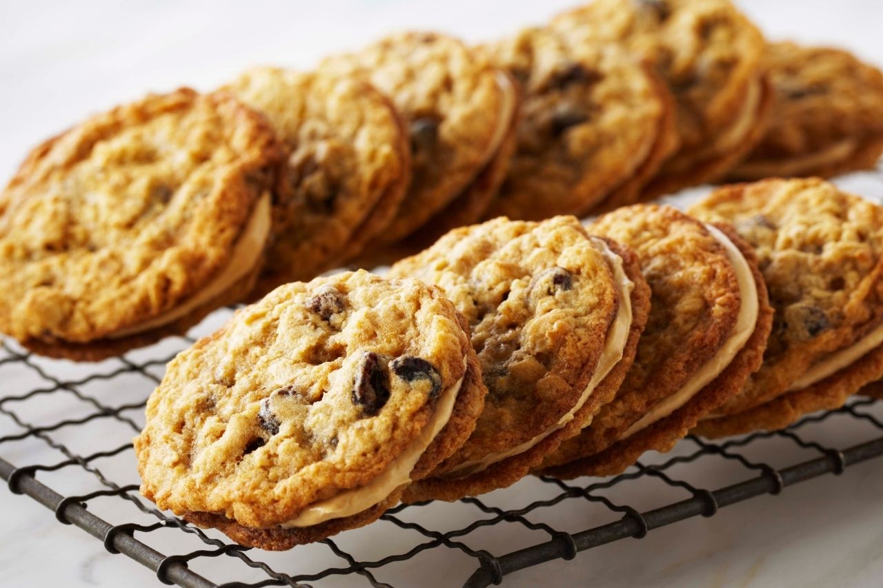 oatmeal raisin sandwich cookies on a cooling rack