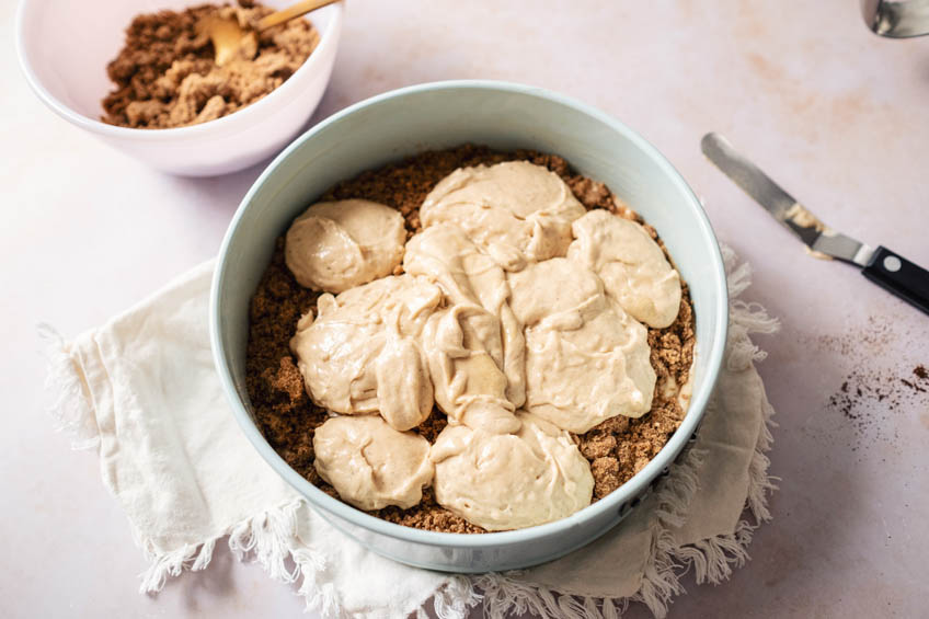 Apple cider cake batter in a cake pan