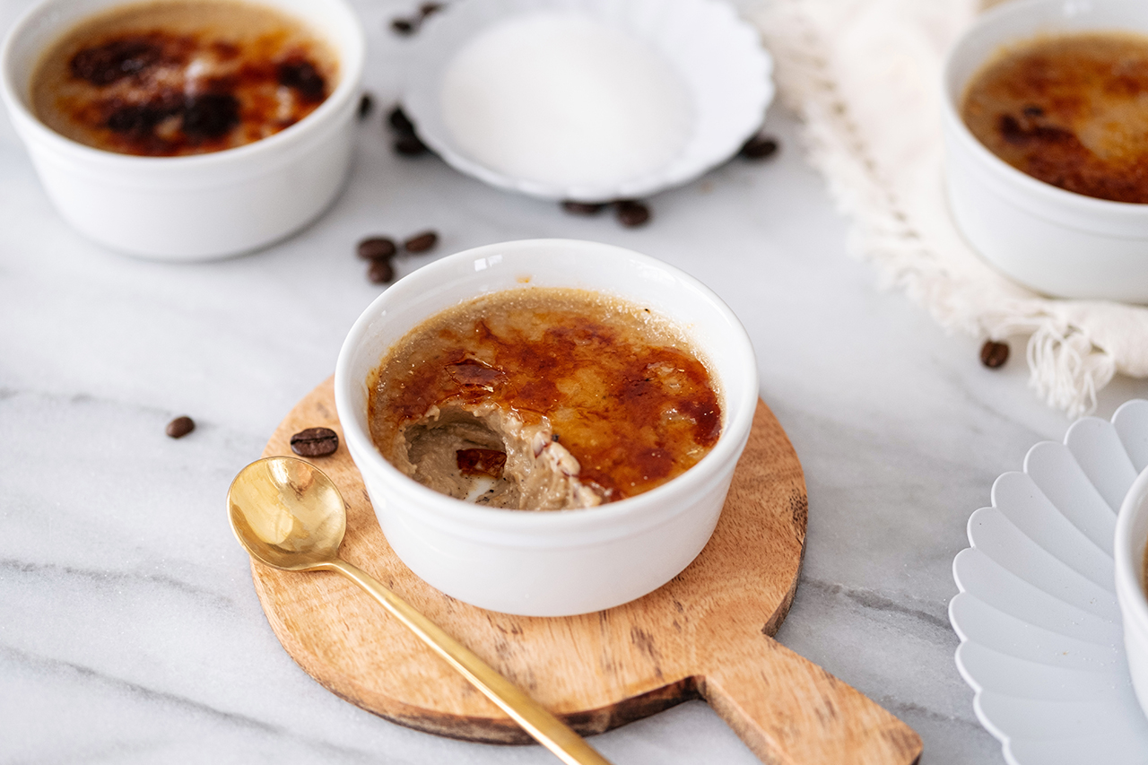 pot of creme brulee on a board