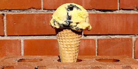 Ice cream cone against a brick building