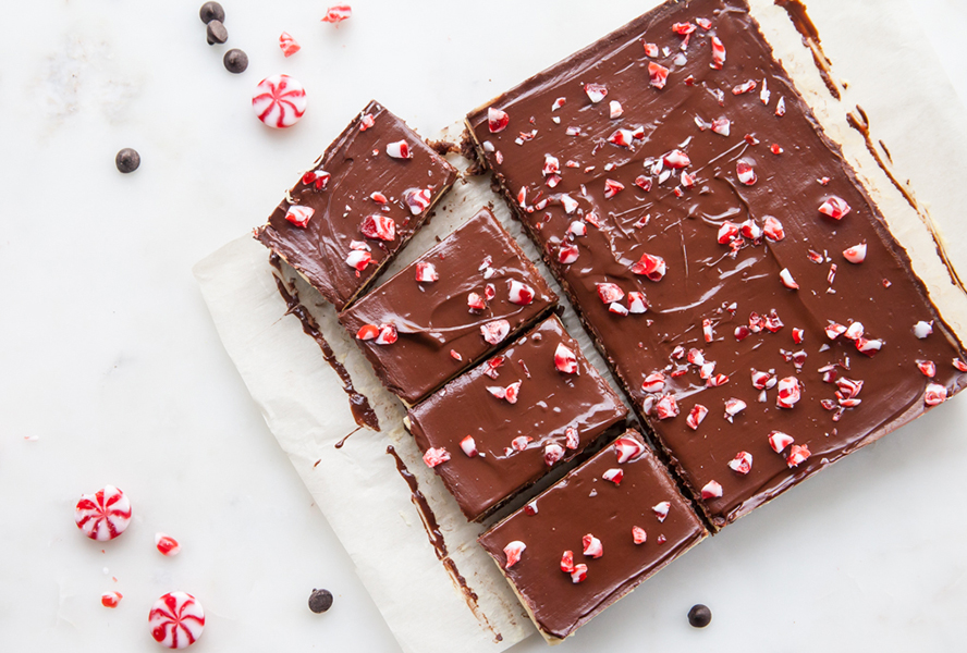 Peppermint nanaimo bar squares on a board