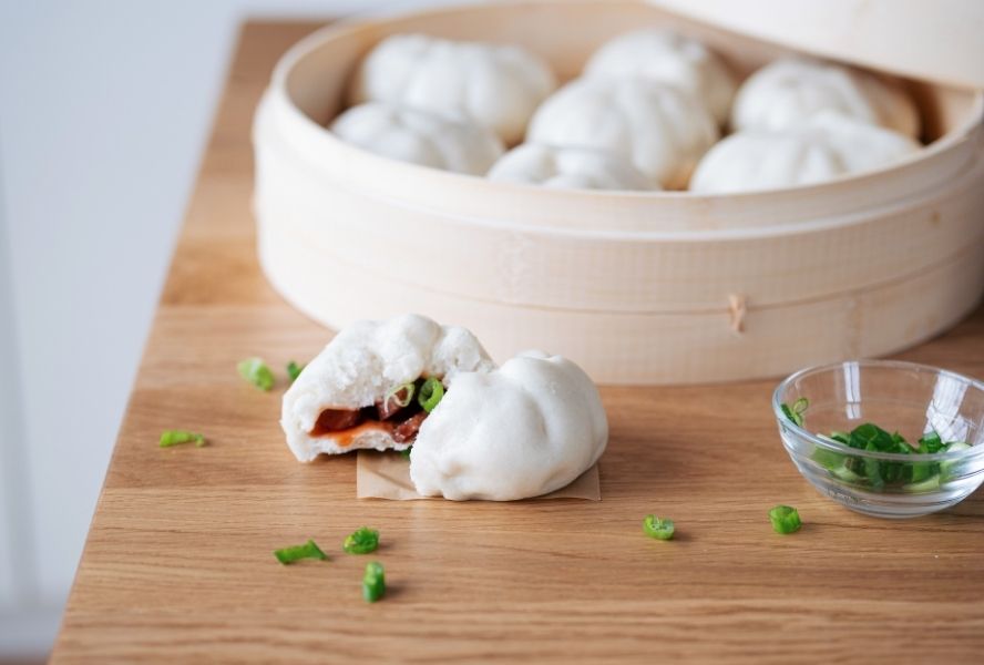 Bao buns in steamer basket