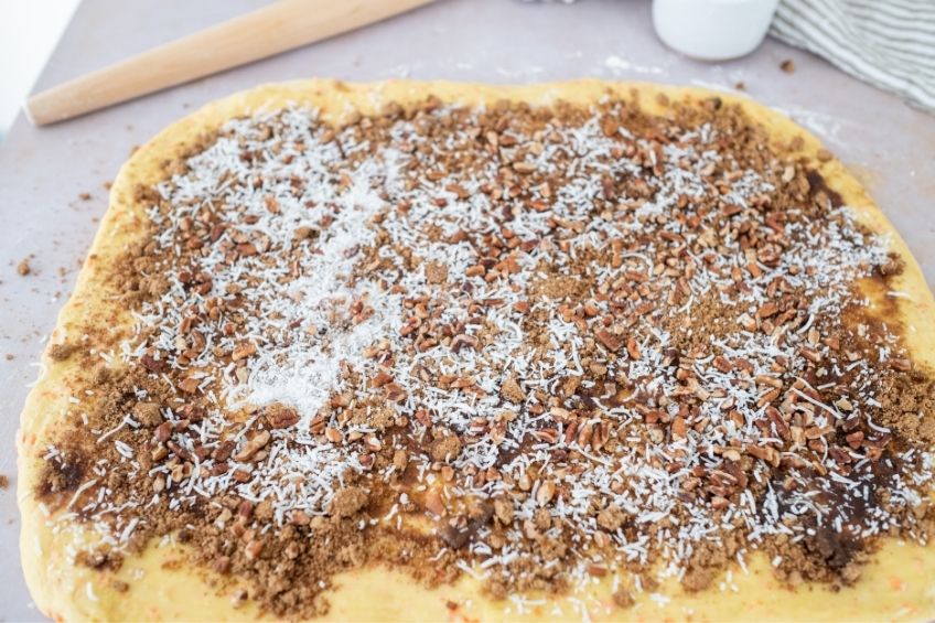 Carrot cake cinnamon roll dough before being rolled up