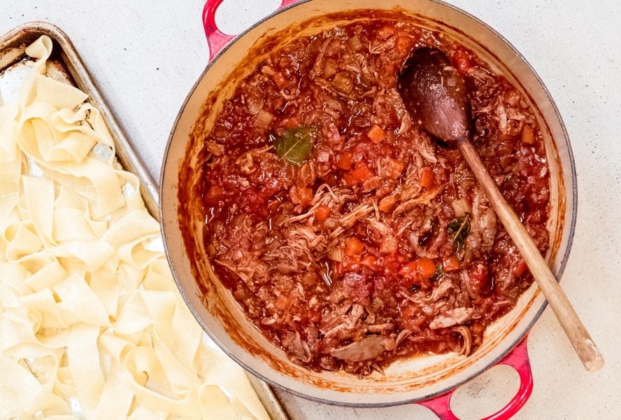 duck ragu cooking in pot