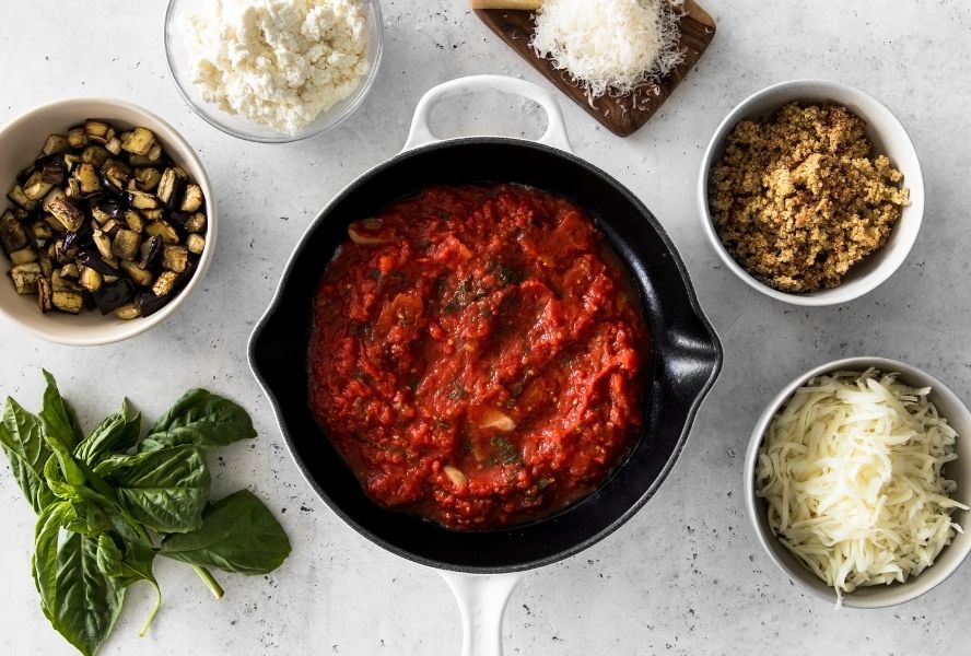 eggplant parm dip ingredients deconstructed on kitchen countertop