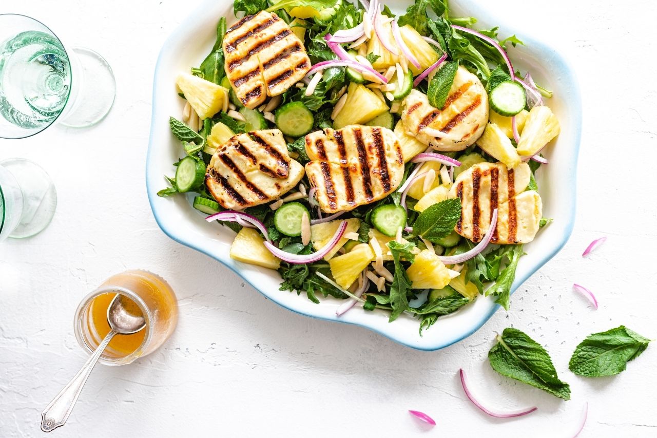 Halloumi cheese on top of salad