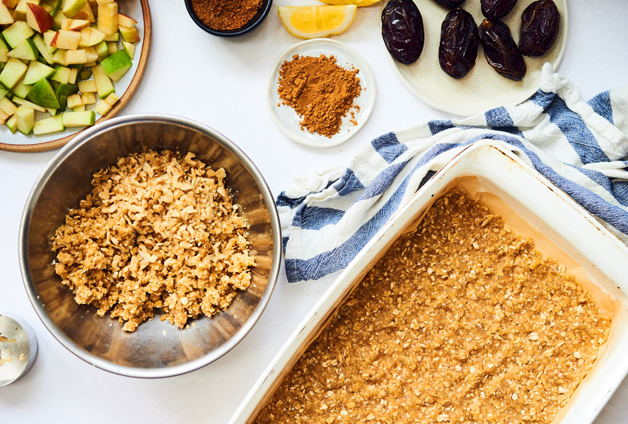 Mise en place with diced apples, dates, rolled oats, and cinnamon