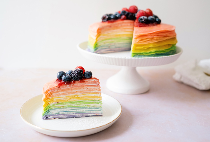 sliced rainbow crepes on a plate