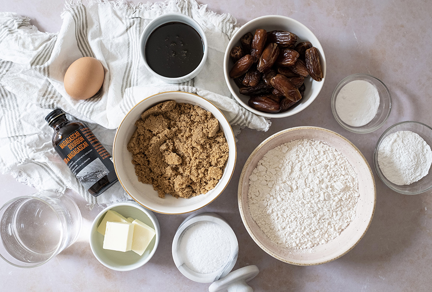 Sticky toffee pudding ingredients including dates, brown sugar, butter and molasses