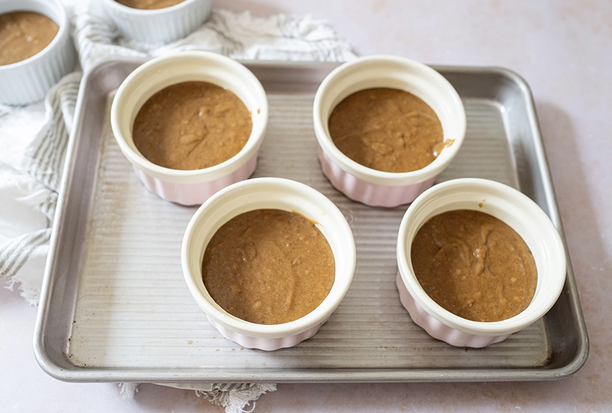 Sticky toffee pudding batter in ramekins