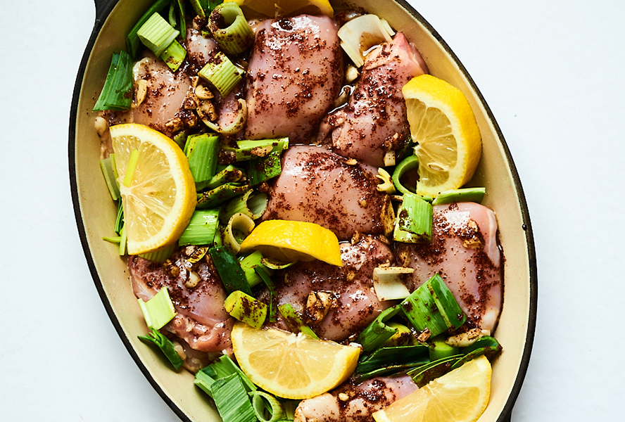 Sumac chicken ingredients in a roasting pan