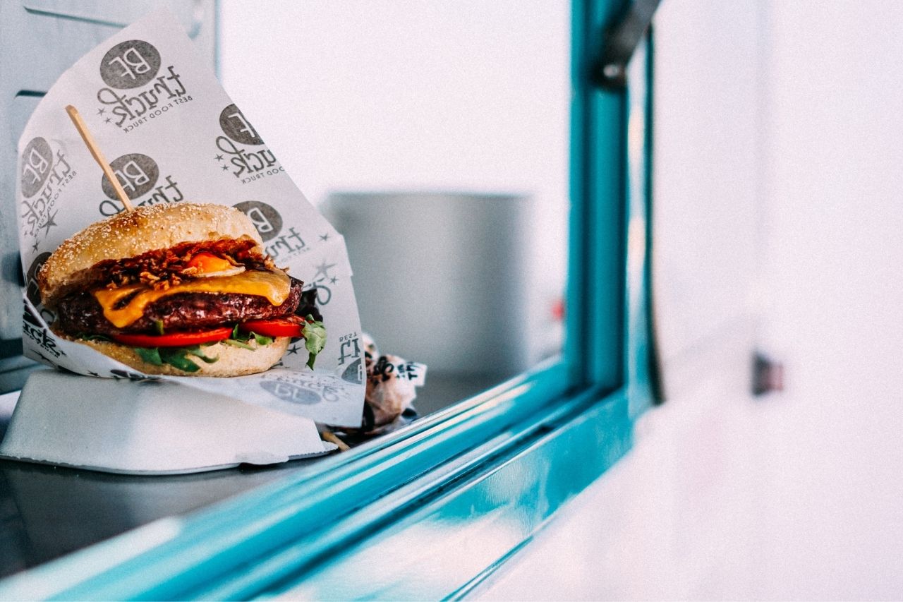 Hamburger sitting in a food truck window