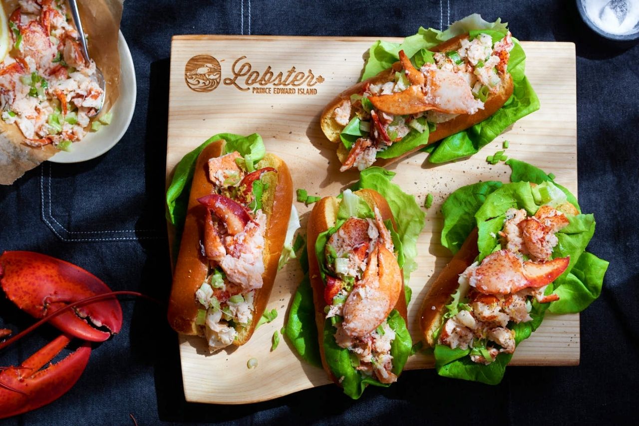 lobster rolls on wood cutting board