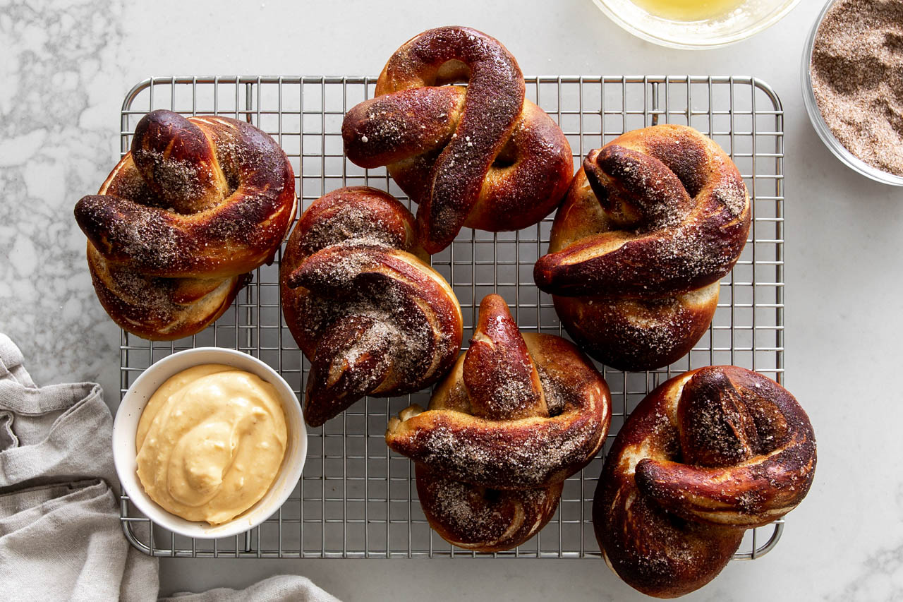 pumpkin spice soft pretzels on a cooling rack