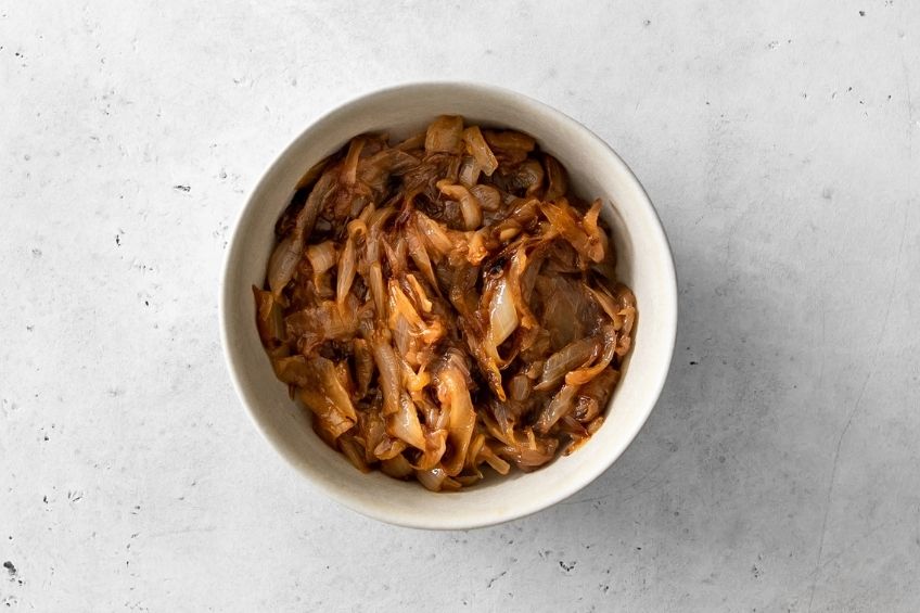 Caramelized onions in white ramekin