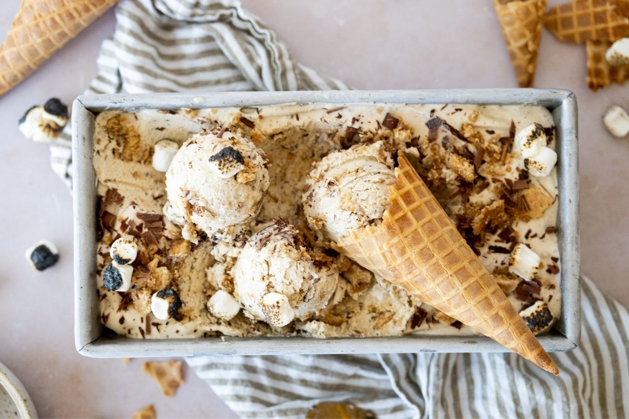 campfire s'mores ice cream being scooped into cone