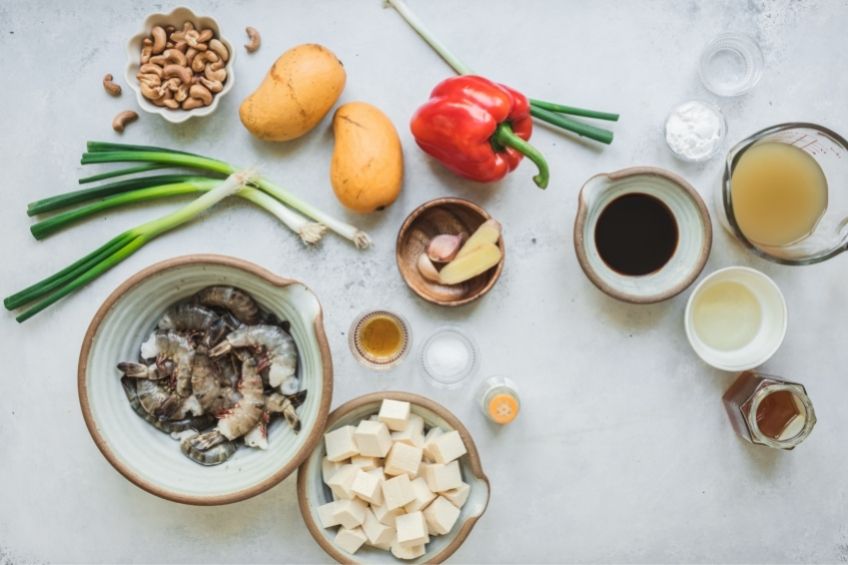 Sweet and sour shrimp and tofu ingredients on countertop