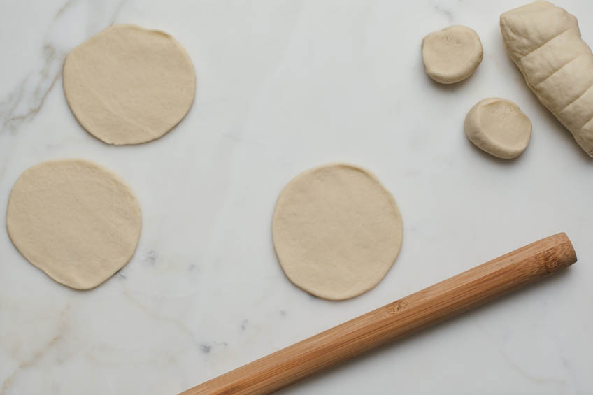 Dough being rolled for Chinese pan-fried buns