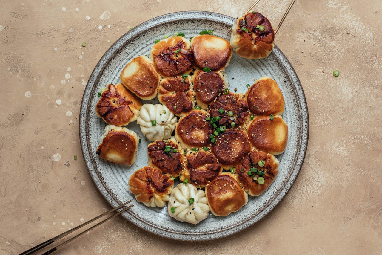 Chinese pan fried buns on a plate