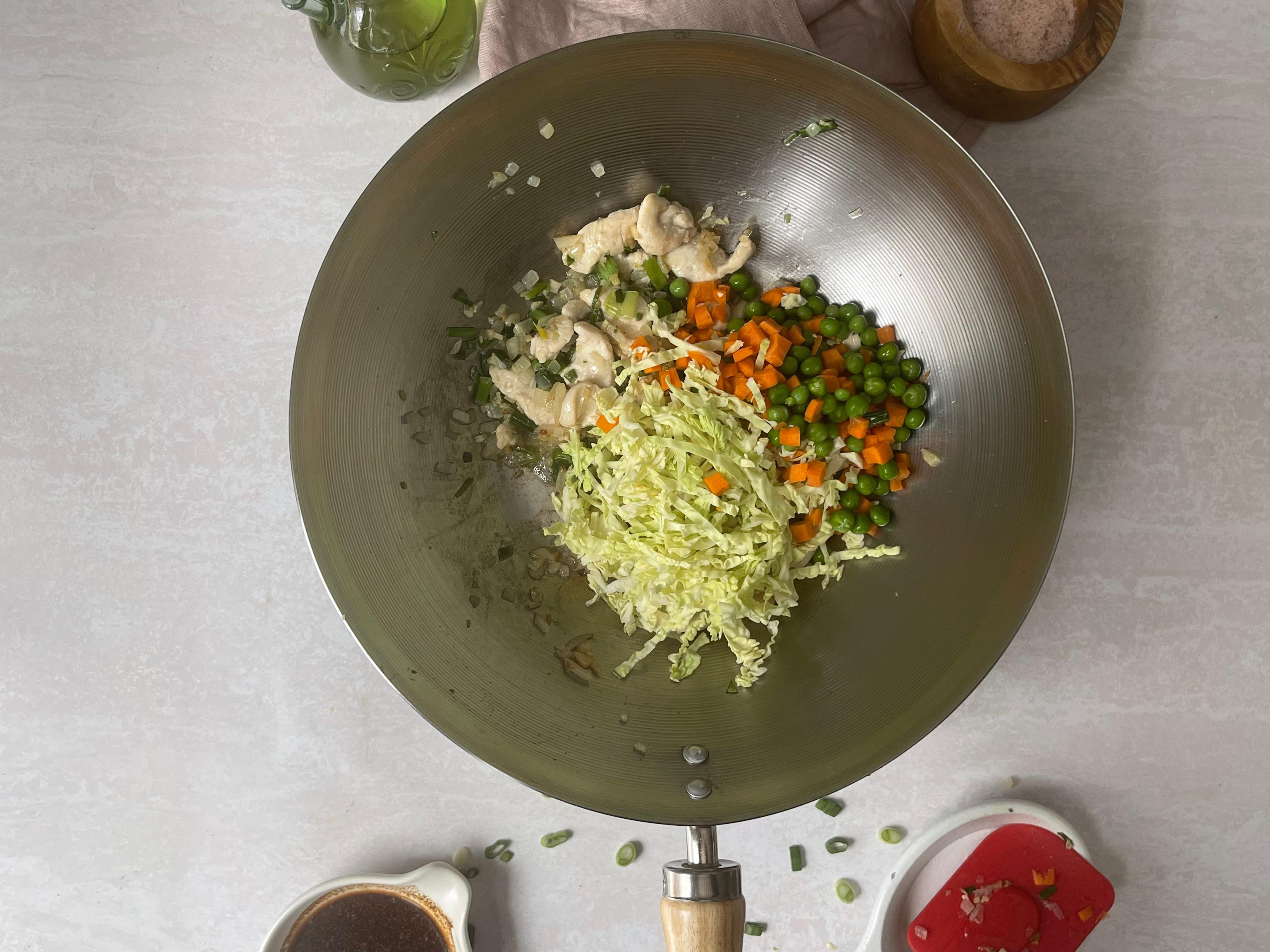 Ingredients for Hakka fried rice in a wok