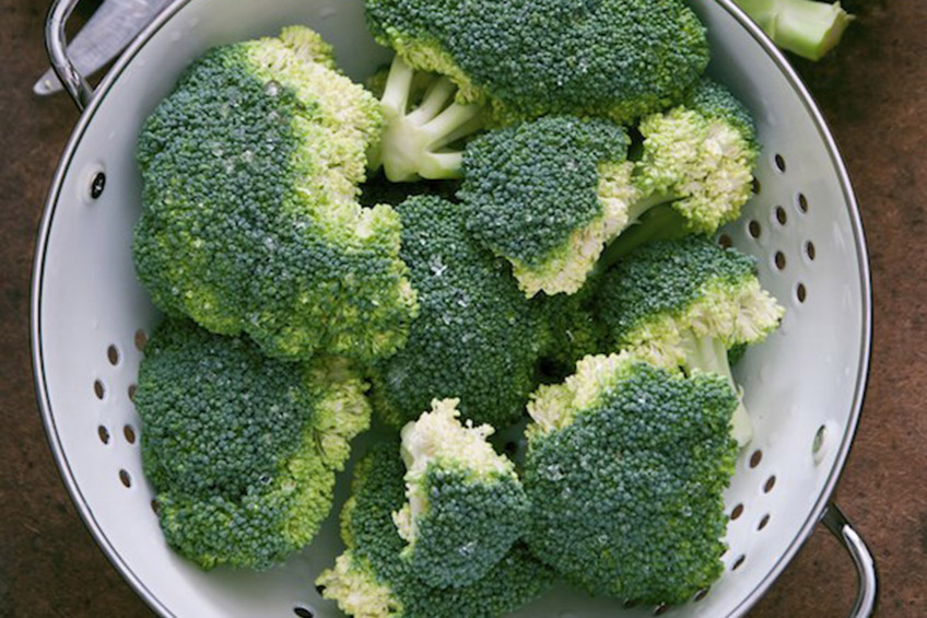 Colander full of broccoli florets