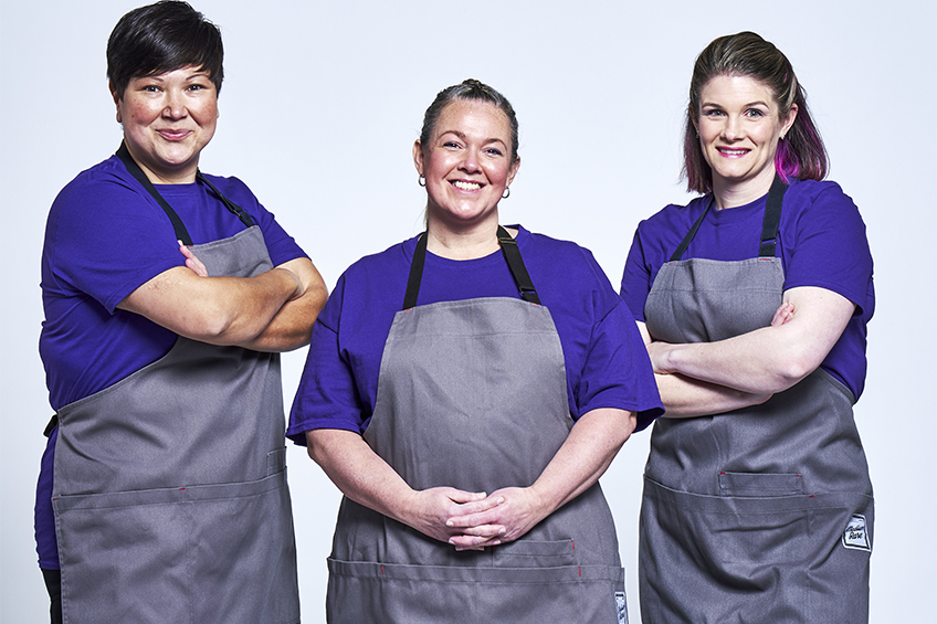 Team For Goodness Cakes smiles at the camera