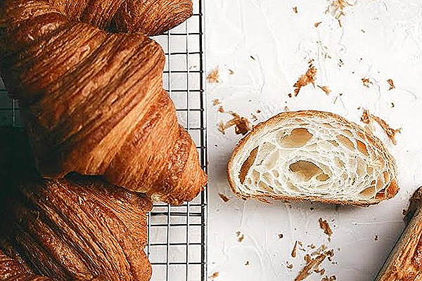 An overhead shot of flaky croissants