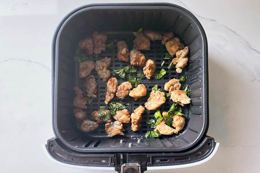 Crispy Taiwanese popcorn chicken in air fryer with basil