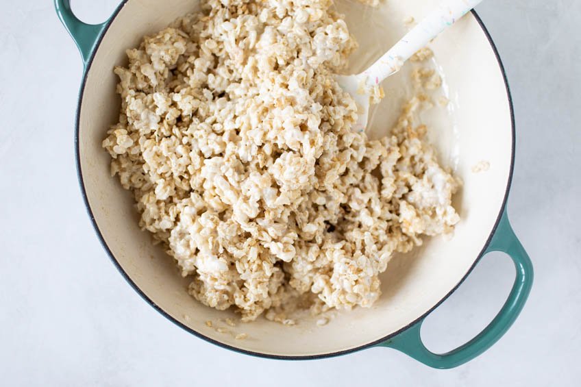 Puffed rice cereal and marshmallow mixture in a pot