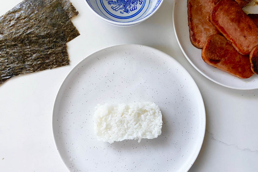 A rectangle of rice on a plate