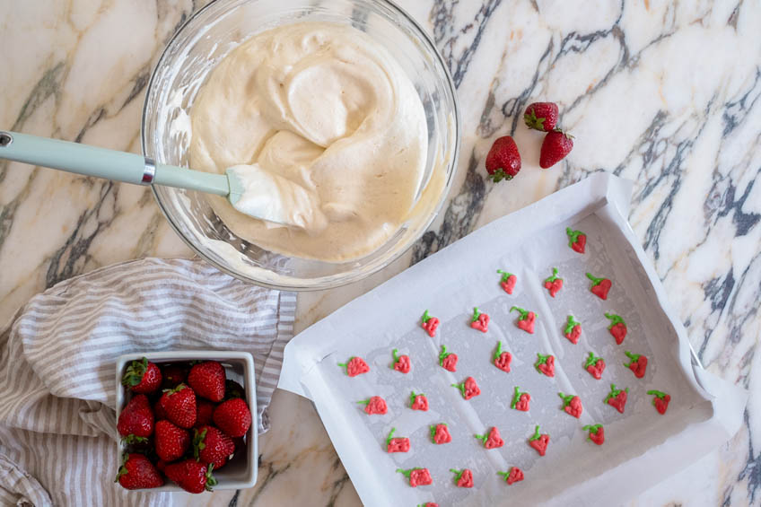 Strawberry designs on parchment paper for strawberry roll cake