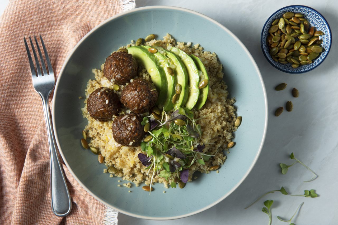 A quinoa power bowl made with Gardein Meatless Meatballs and avocado