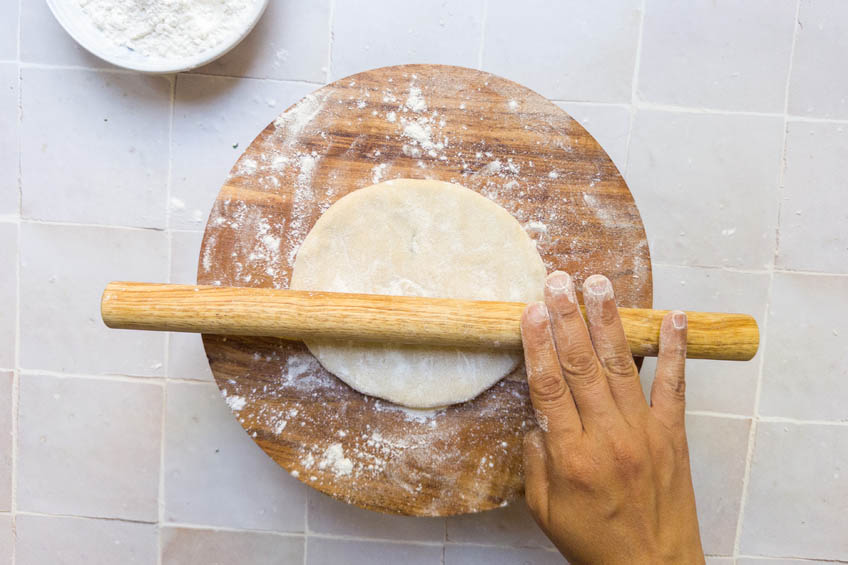 Aloo paratha being rolled out