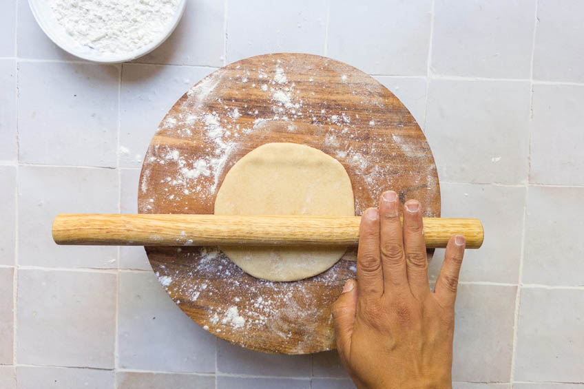 Dough for aloo paratha being rolled out