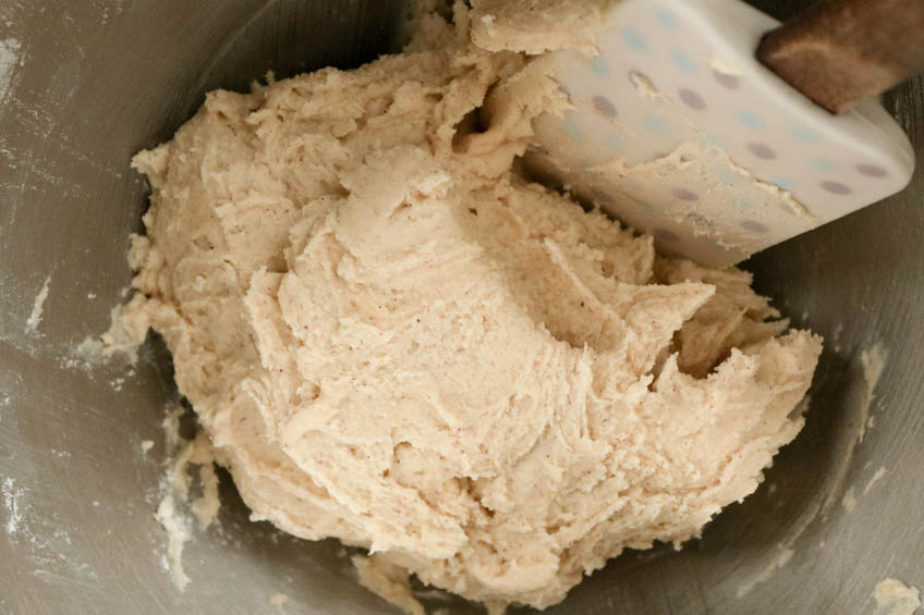 Dough for Gingerbread Spiced Shortbread Wreath Cookies in a mixing bowl