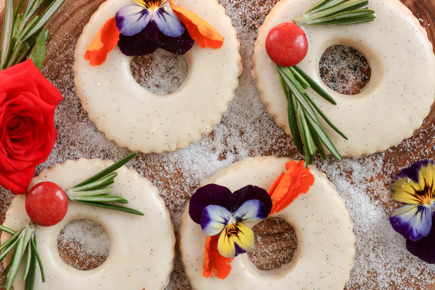 A closeup of Gingerbread Spiced Shortbread Wreath Cookies