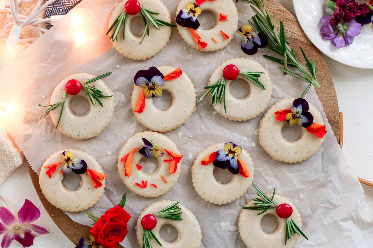 Gingerbread Spiced Shortbread Wreath Cookies on parchment paper