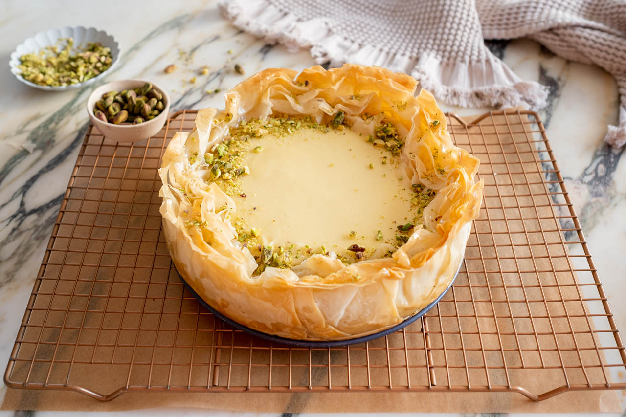 Baklava cheesecake on a cooling rack