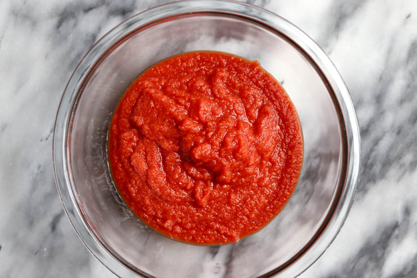 Blended aromatics and tomatoes in a bowl