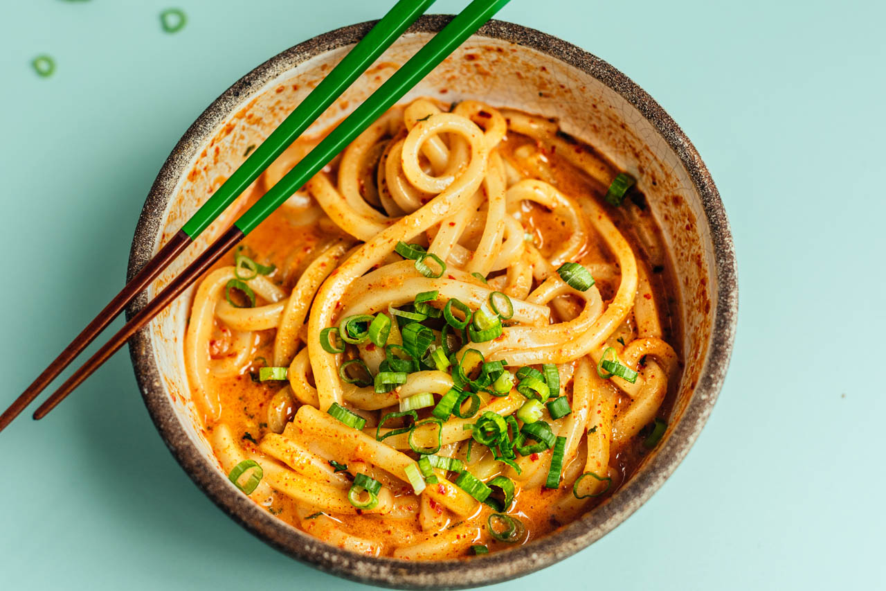 Fiery Korean udon carbonara in a bowl