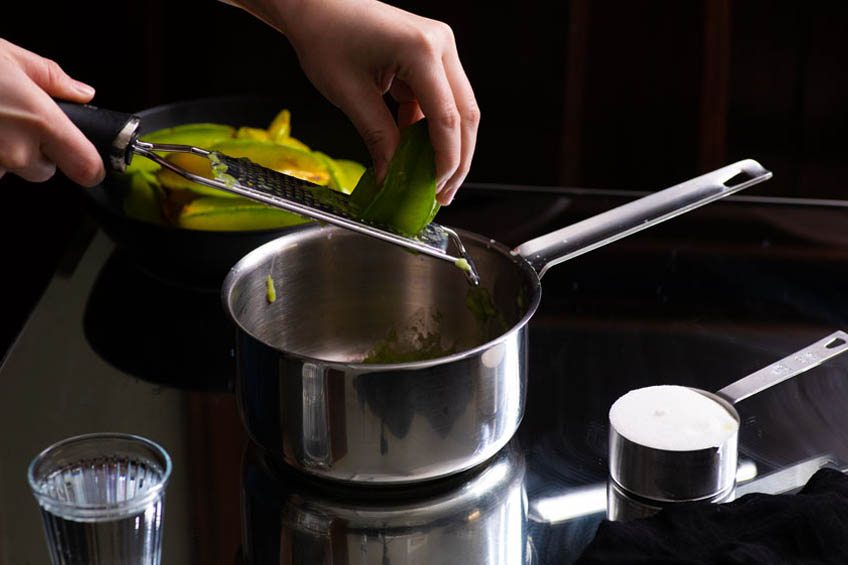 Starfruit syrup in a sauce pan