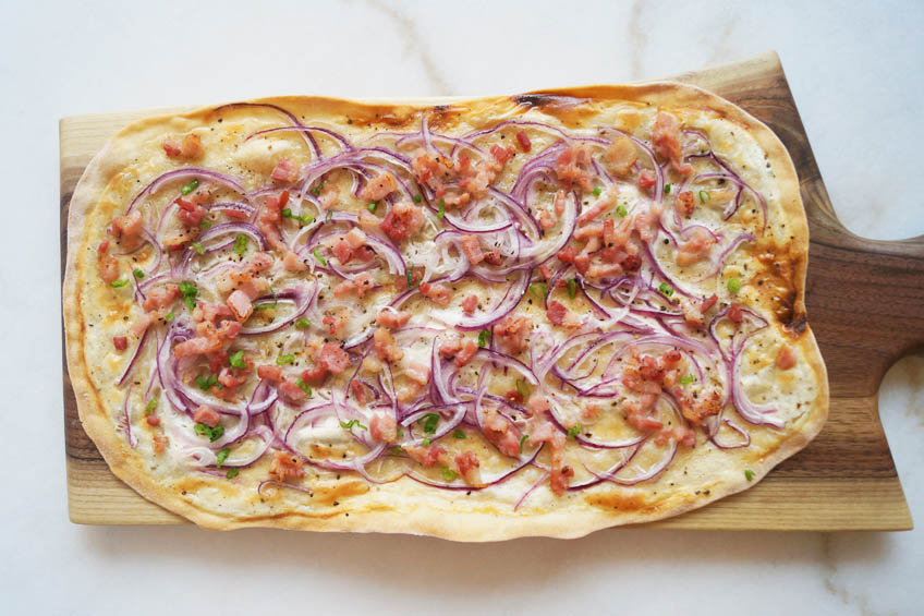 Flammkuchen on a serving board