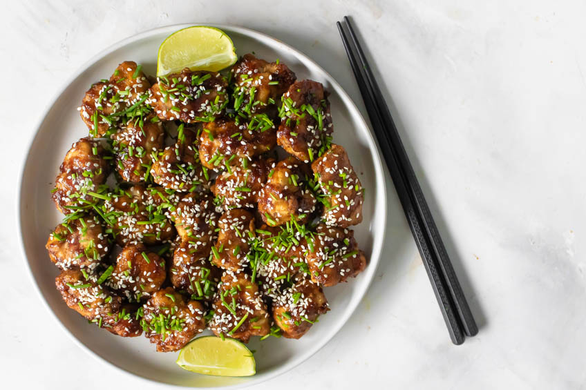 Oven-fried honey garlic chicken bites on a plate