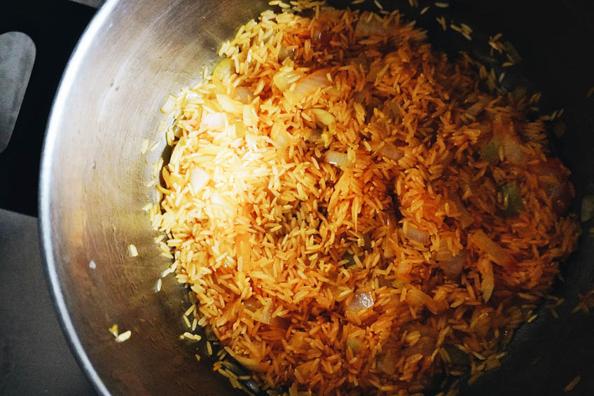 Ingredients for lugaw (Filipino rice porridge) in a large pot