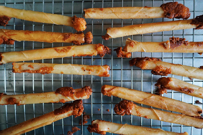 Crispy cheese lumpia on a wire rack