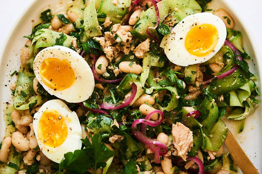 plate of tuna and white bean salad with pickled onions and jammy eggs