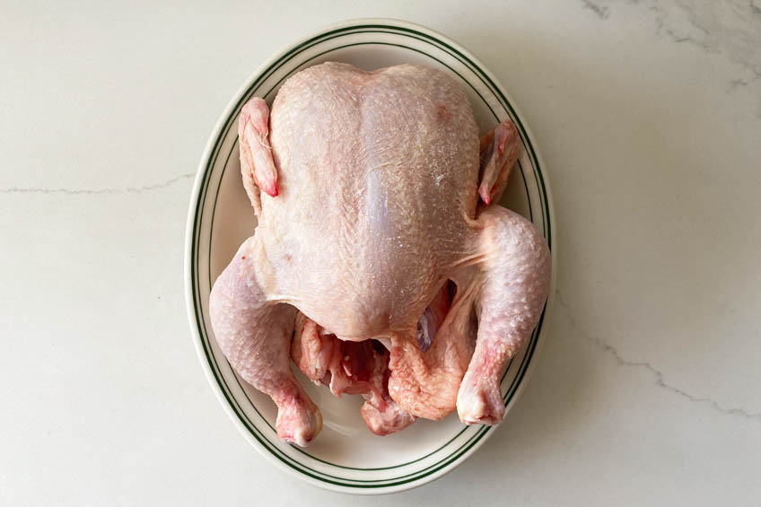 A salted chicken on a plate